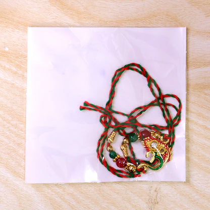 Om and Peacock Feather Enamel Pendant Rakhi with Multicolor Beads