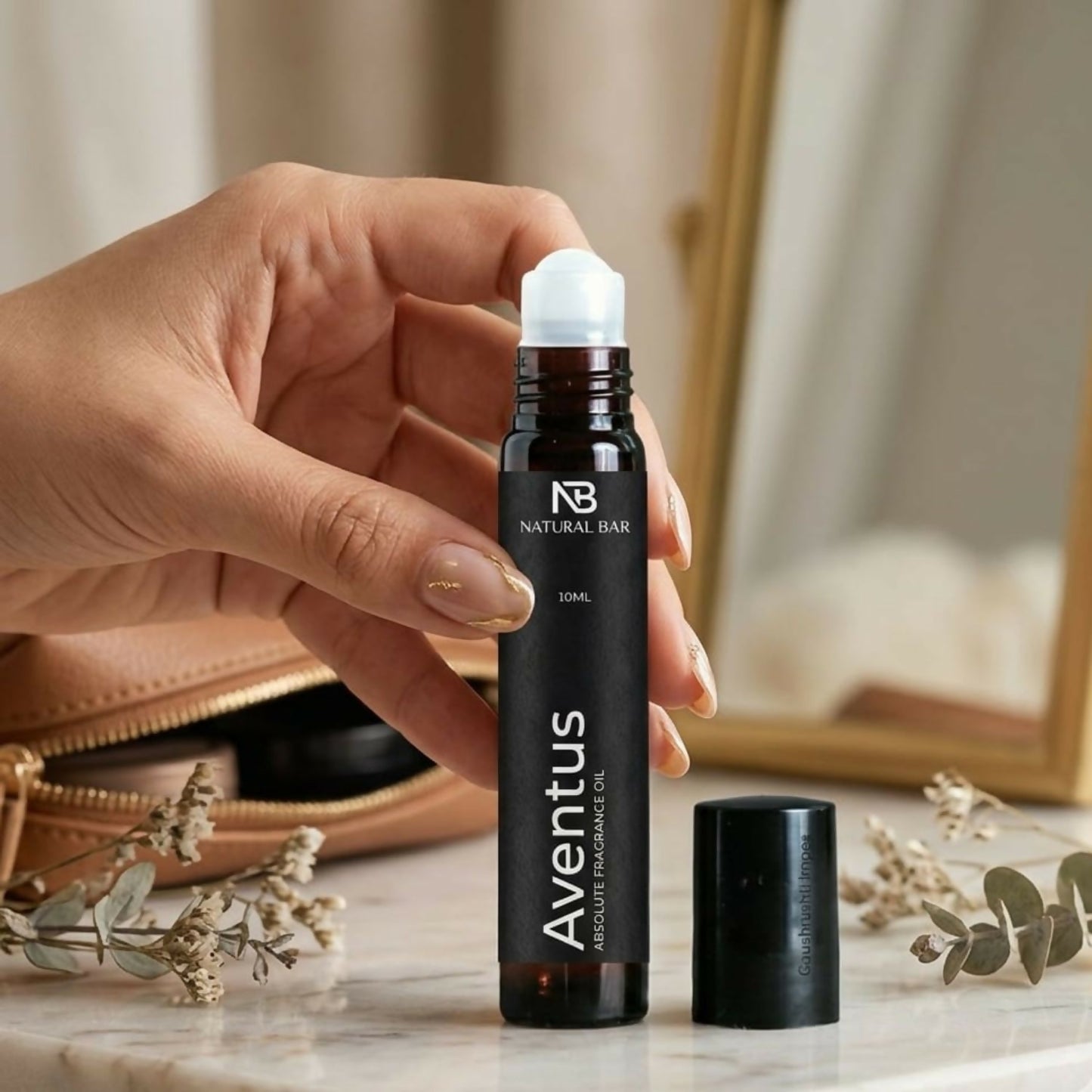Close-up of Aventus perfume roll-on with sleek 10ml bottle