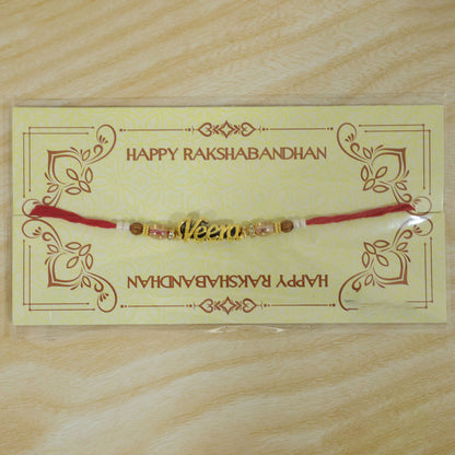 Veera Name Golden Rakhi with White Brown Beads, Red Thread and Premium Finish