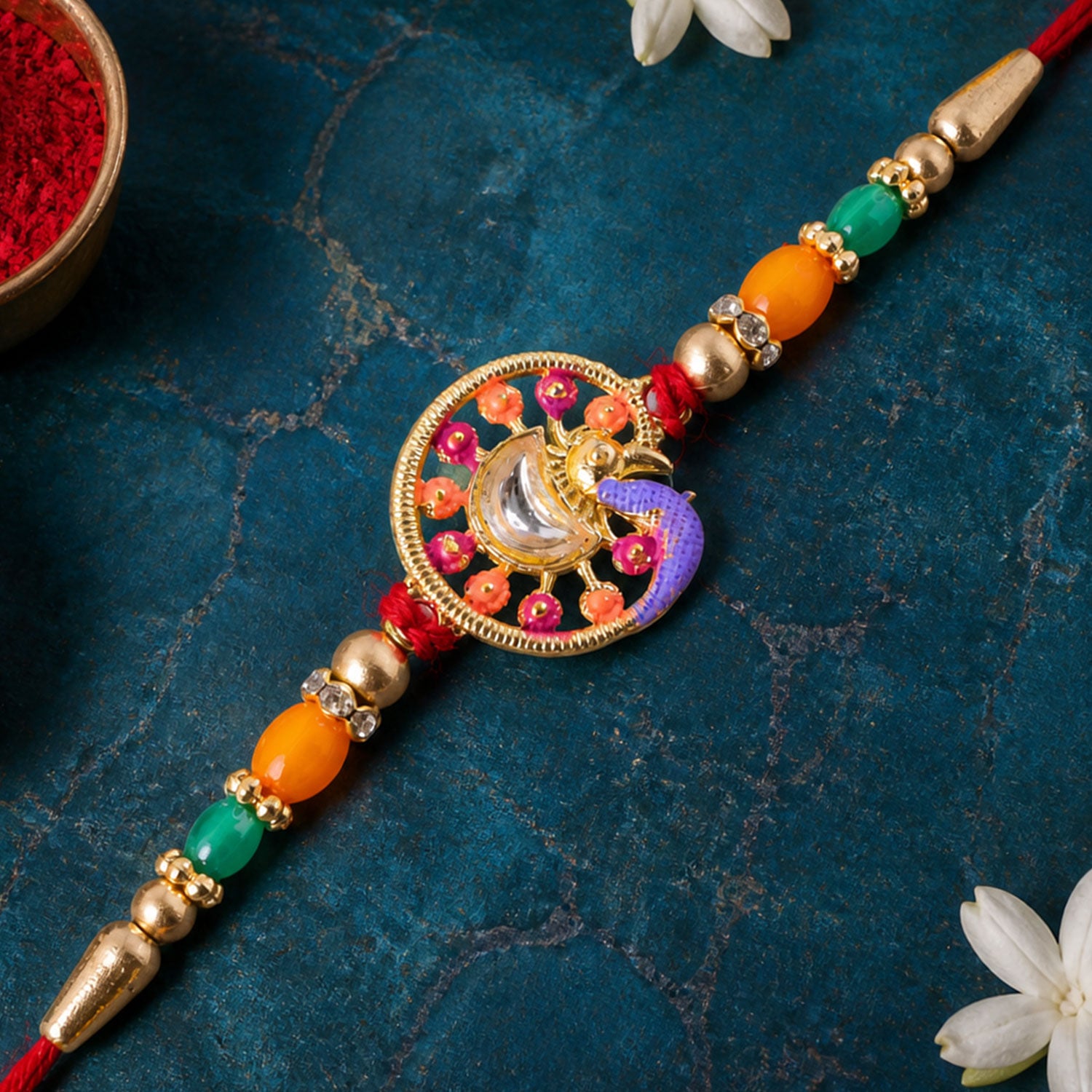Traditional Rakhi with Round Sacred Medallion, gold trims and chain look for Gift Use
