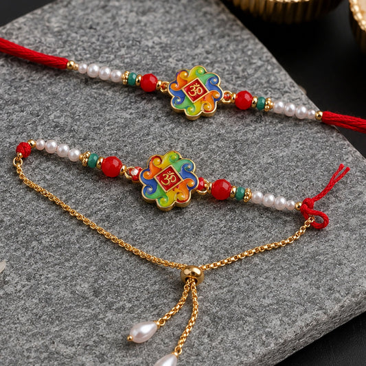 Elegant Om Symbol Rakhi with pearl beads and soft red thread