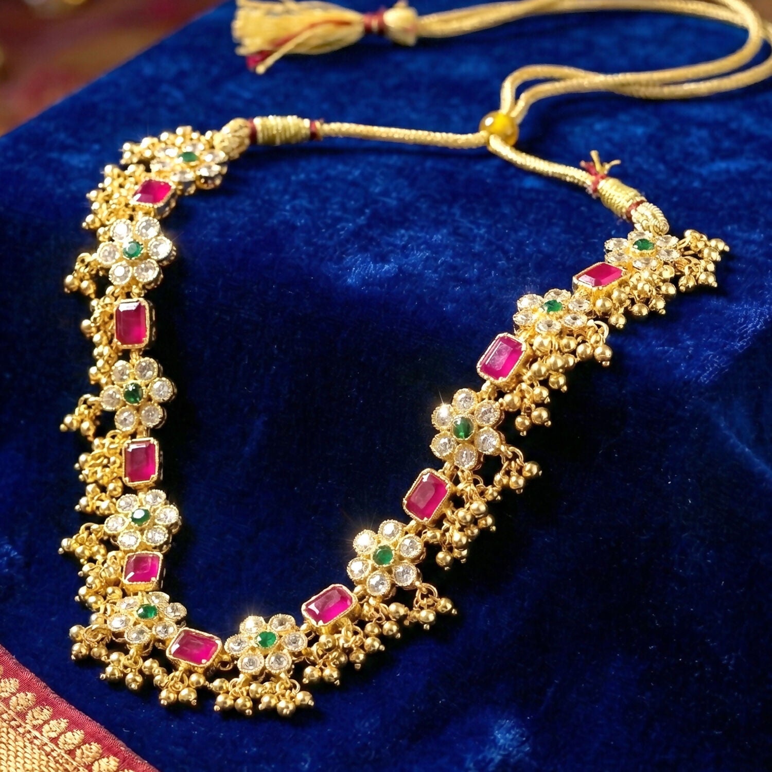 Traditional gold necklace set with matching earrings accessible