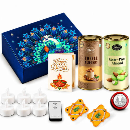 A blue box with a peacock design, two almond tins, a Diwali card, six LED tealights, a remote, two yellow Shubh Labh