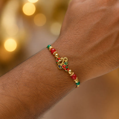Colorful Enamel Peacock Pendant Rakhi with Red and Green Beads