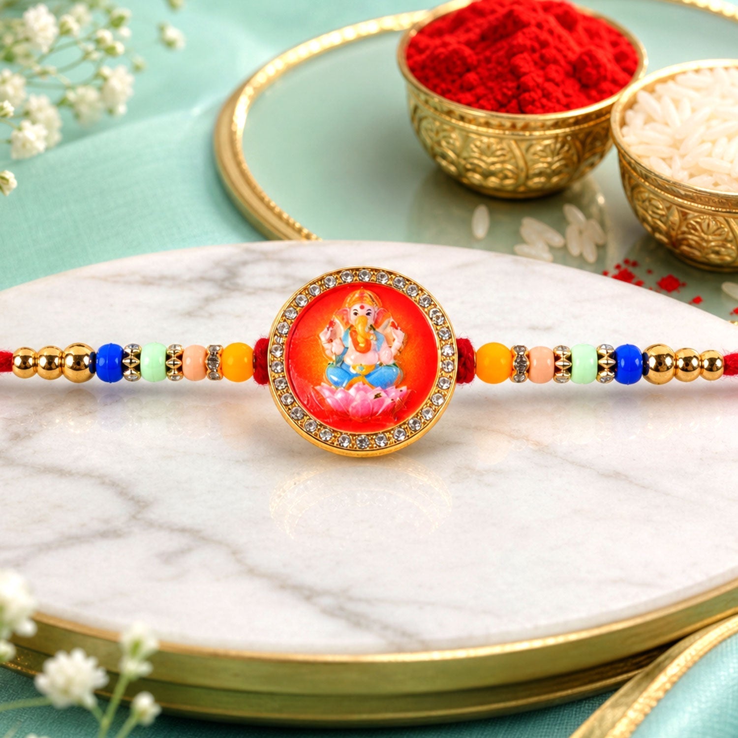 Ganesha Rakhi for Brother Golden Motif with Stones & Beads (5pcs)