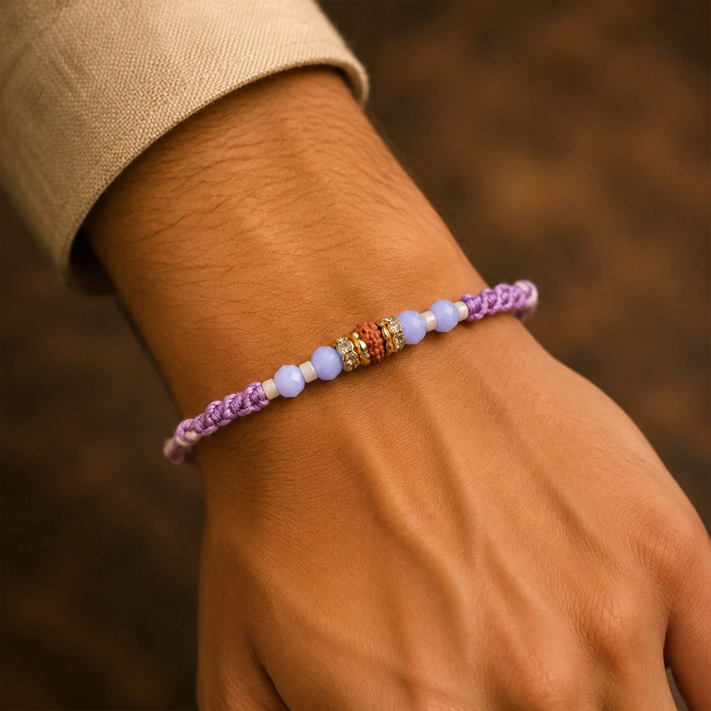 Sparkling Pearl Stone Rakhi with Colorful Thread and Premium Festive Beauty