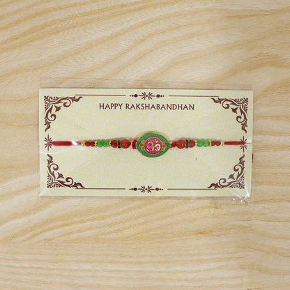 Festive Raksha Bandhan Rakhi featuring pink green OM design