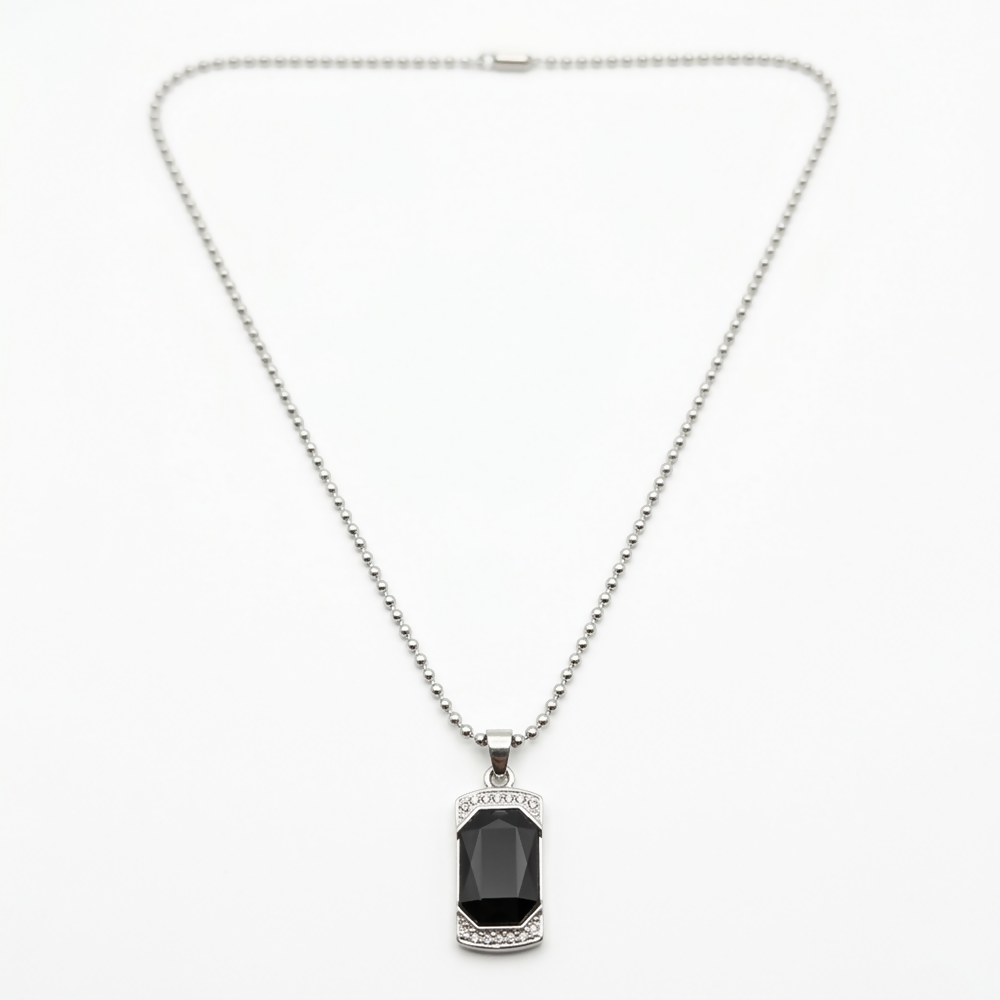 Black onyx pendant necklace displayed on a dark background
