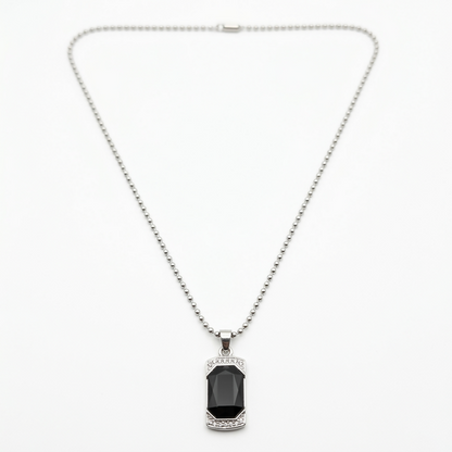 Black onyx pendant necklace displayed on a dark background