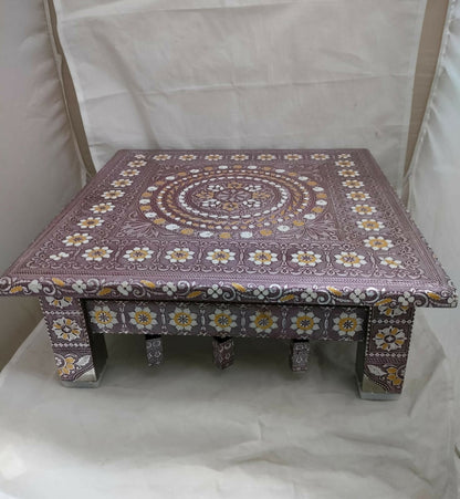 Stylized shot of the Rajwadi oxidised Pooja Chowki, highlighting its golden finish.