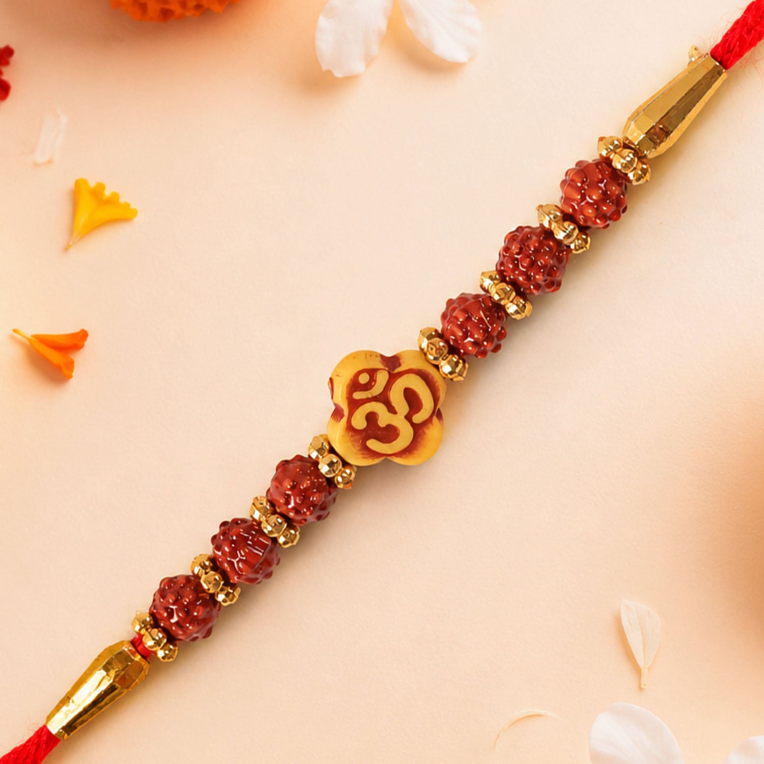 Om Bead Rakhi with Red Brown Accents and Spiritual Festive Brother Gift Styling Ideas