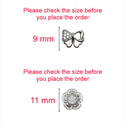Pair of silver plated bow and flower cubic zirconia stud earrings displayed together