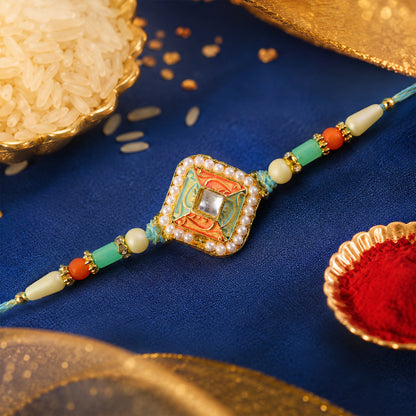 Pearl Bordered Meenakari Pendant Rakhi with Orange and Teal Enamel