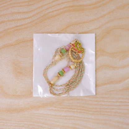 Enamel Peacock Pendant Rakhi with Green and Orange Beads