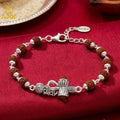 Mahadev Trishul Damru Rakhi – Silver with Natural Rudraksha Beads