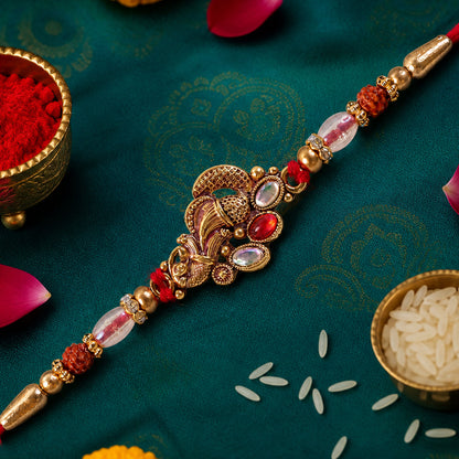 Elegant Rakhi with Ornate Floral Medallion and metal trims in chain look for Gift Use