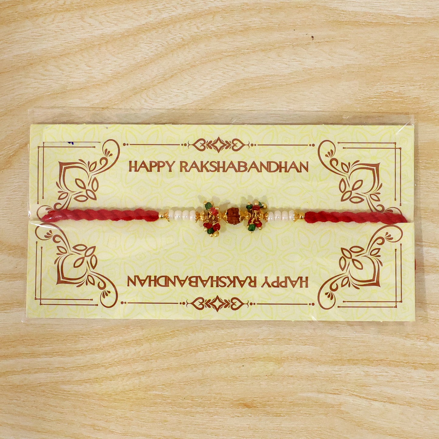 Red Pearl Designer Rakhi with Golden Accents and Compact Festive Beauty