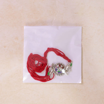 Festive Rakhi showcasing Petal Floral Medallion, pearl accents and bead line for Gift