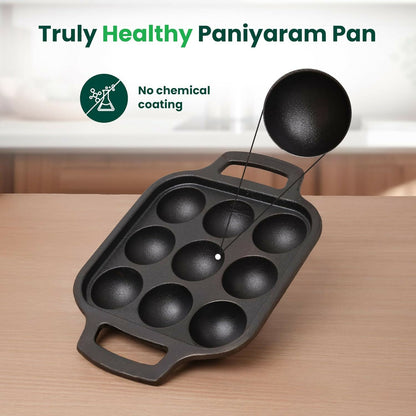 Close up of cast iron appam patra pan cavities