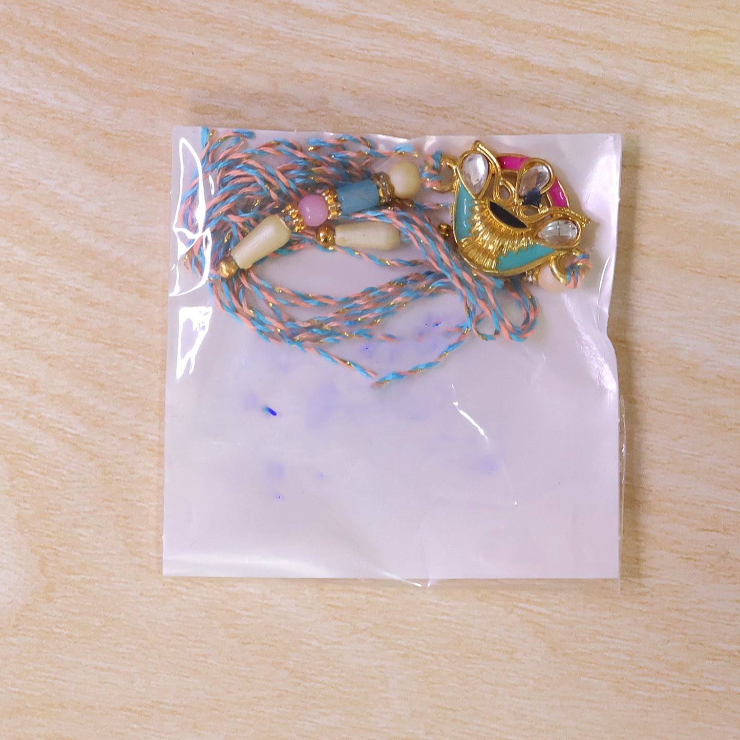 Crown Shaped Kundan Pendant Rakhi with Pink and Teal Enamel