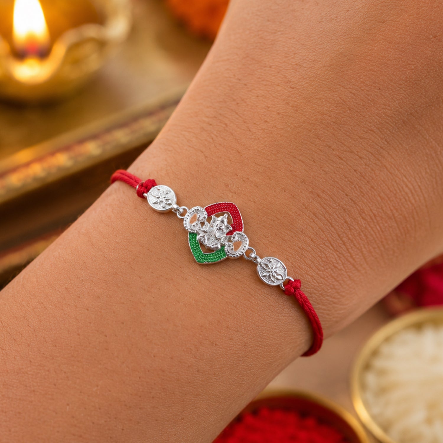 Silver Green Floral Rakhi with Red Thread and White Side Charms