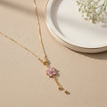 Pink Floral Crystal Pendant Necklace – Elegant Gold Tassels
