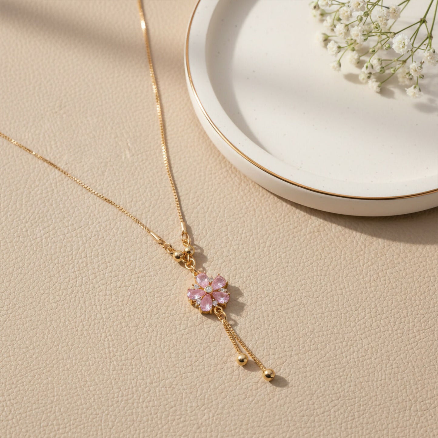 Pink floral crystal pendant necklace with gold chain and twin tassel drops