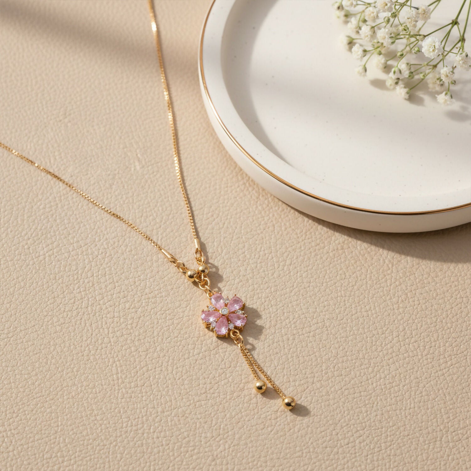 Pink floral crystal pendant necklace with gold chain and twin tassel drops