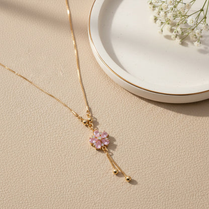 Pink floral crystal pendant necklace with gold chain and twin tassel drops