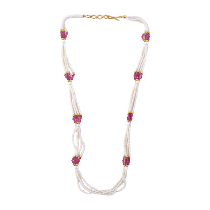 Side view of white bead mala necklace with pink traditional accents