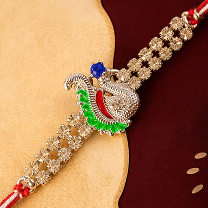 Festive Rakhi with Peacock Charm, pink accents and display look for Gift Styling