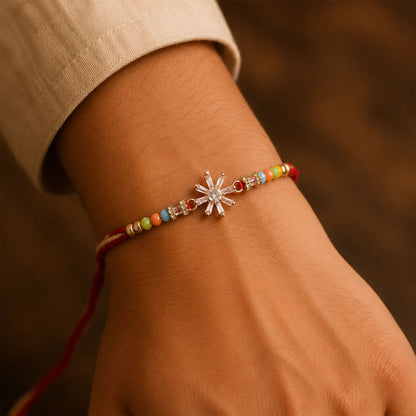Rose Gold Sunburst Crystal Rakhi with Rainbow Beads, Roli Chawal Coin and Festive Gift Packing