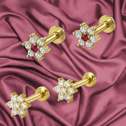 Gold plated flower stud earrings showcasing delicate six-petal design with flat back