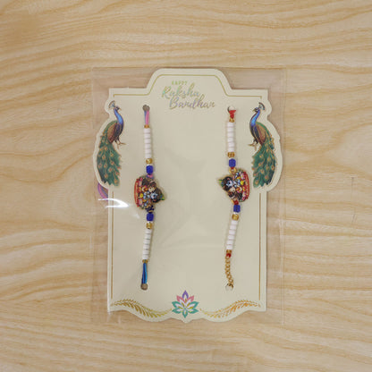 Radha Krishna Cartoon Printed Pearl Beads Bhai Bhabhi Rakhi Set