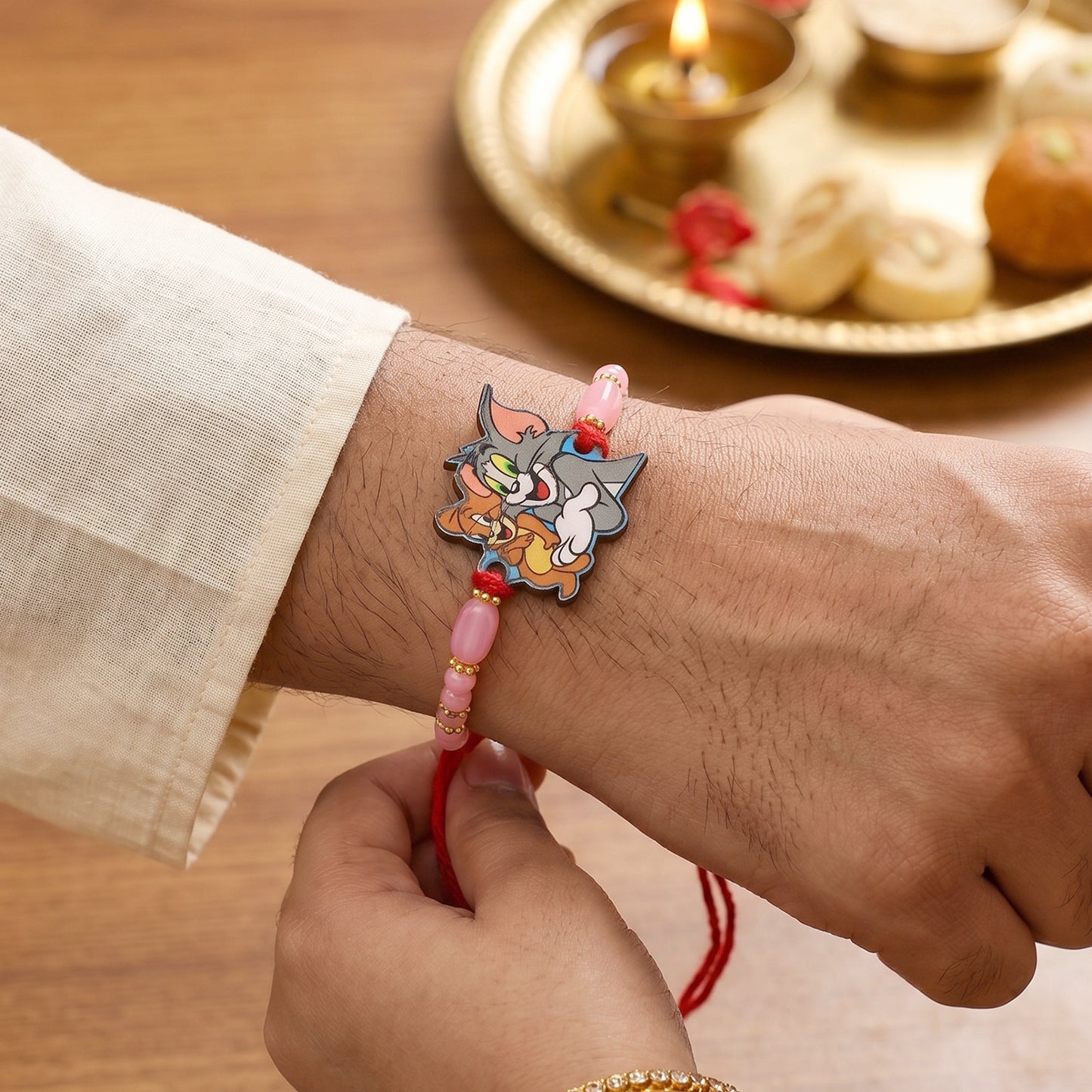 Cartoon Kids Rakhi with Pink Beads and Gold Accents