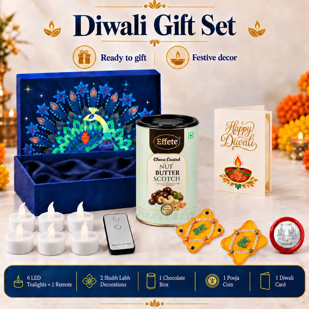 A Diwali gift set including a blue peacock box, a tin of nut butterscotch, a greeting card, LED tealights, and two