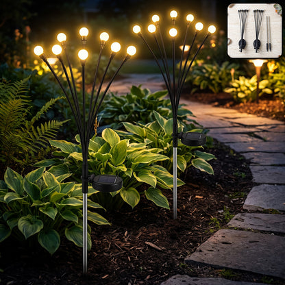 Two solar firefly garden lights glowing outdoors