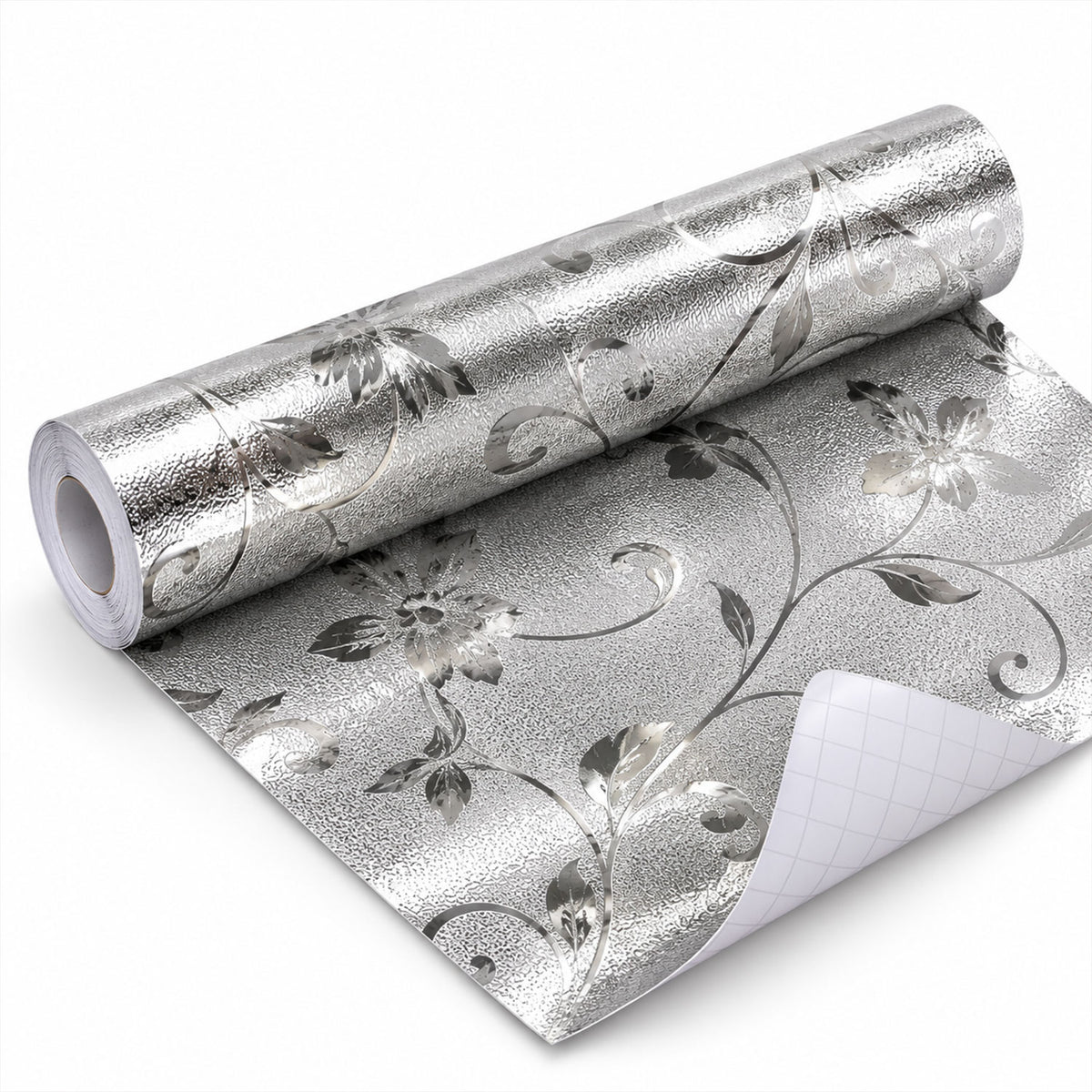 A partially unrolled roll of silver floral textured wallpaper with the grid backing visible on a white surface.