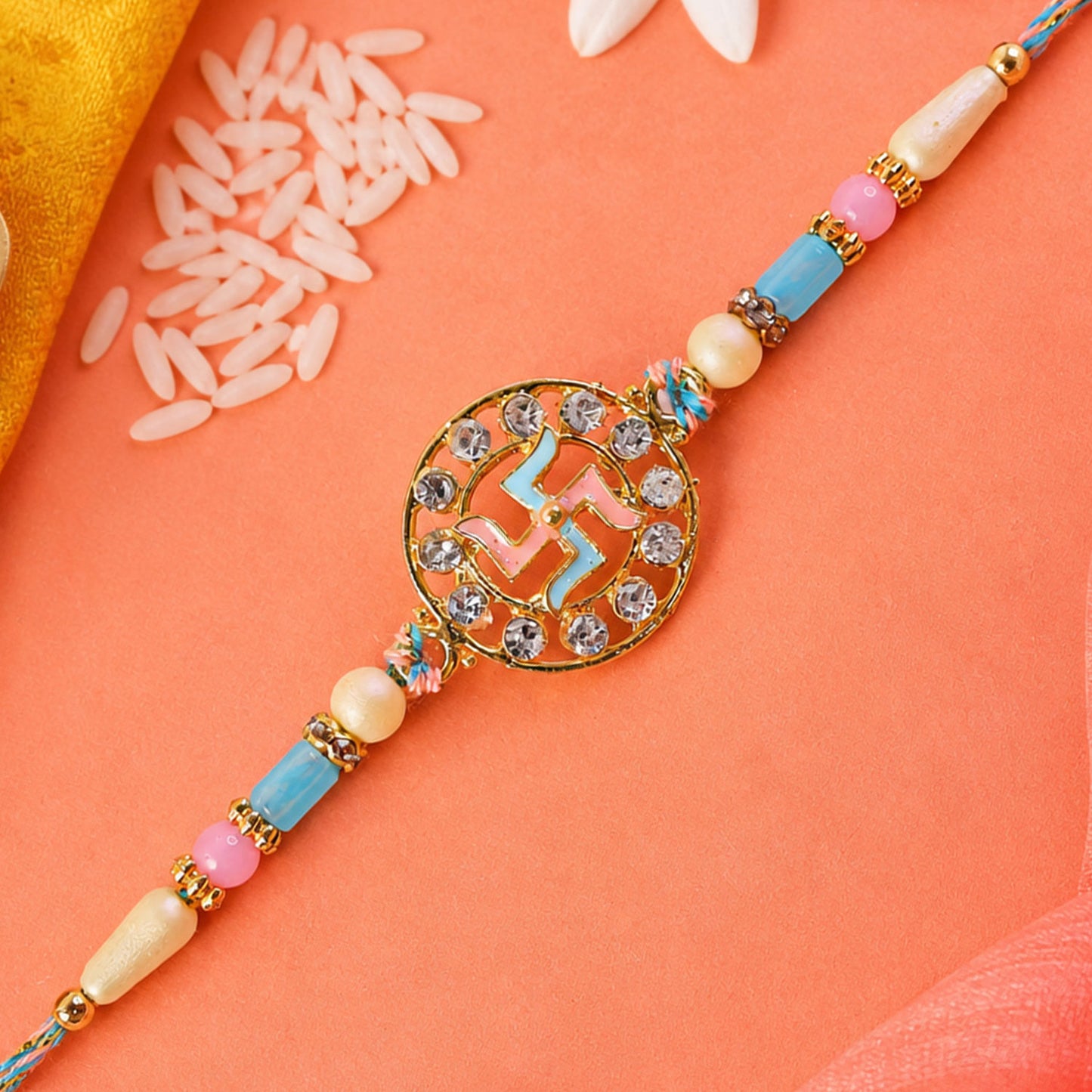 Divine Rakhi showcasing Swastik Circle Plaque, gold trims and chain look for Gift Use