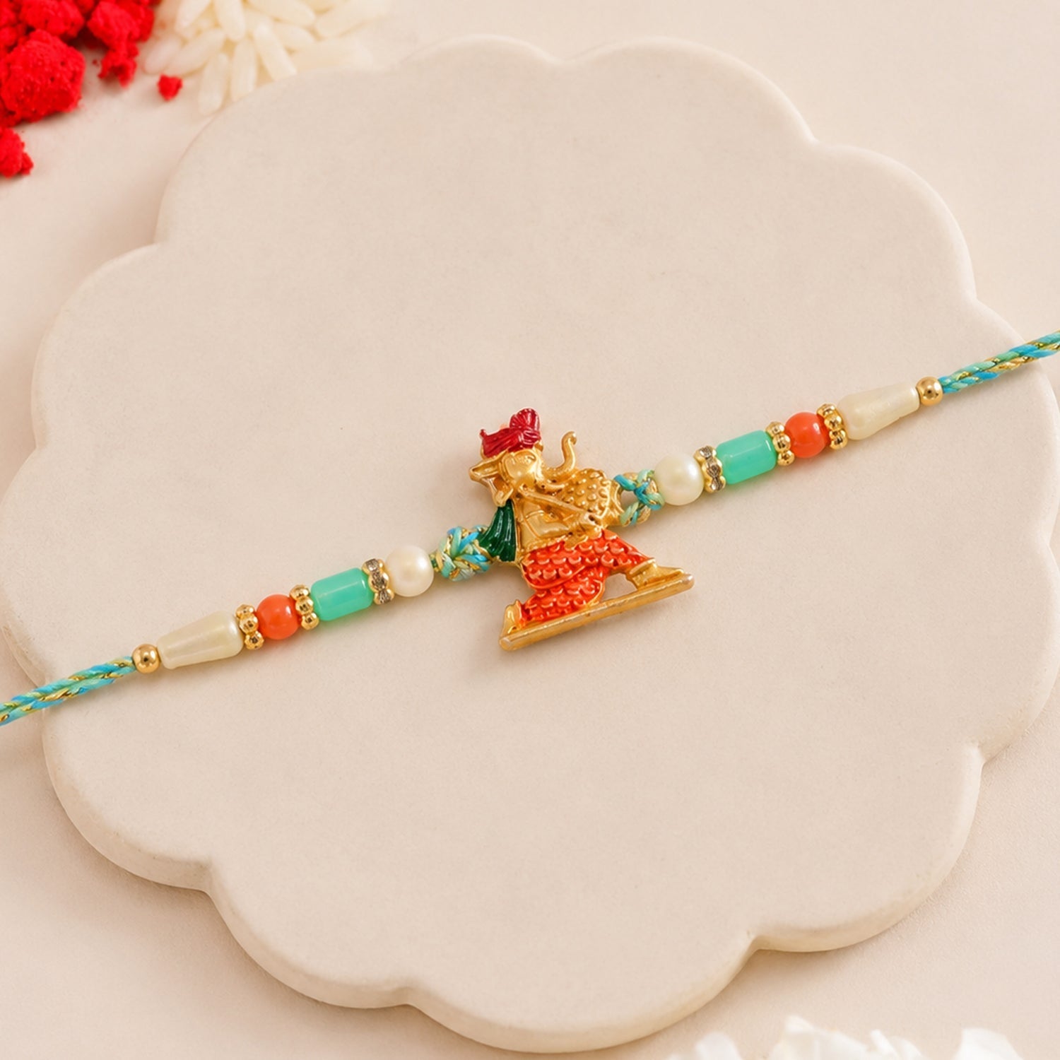 Ganesh Charms Rakhi with Turquoise and Pearl Beads Elegant Festival Accessory (5pcs)