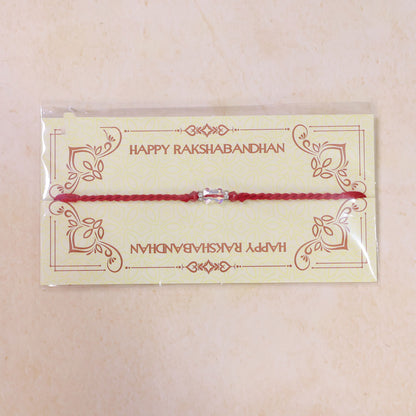 Red Thread Rakhi with an Iridescent Bow-Tie Shaped Crystal Bead