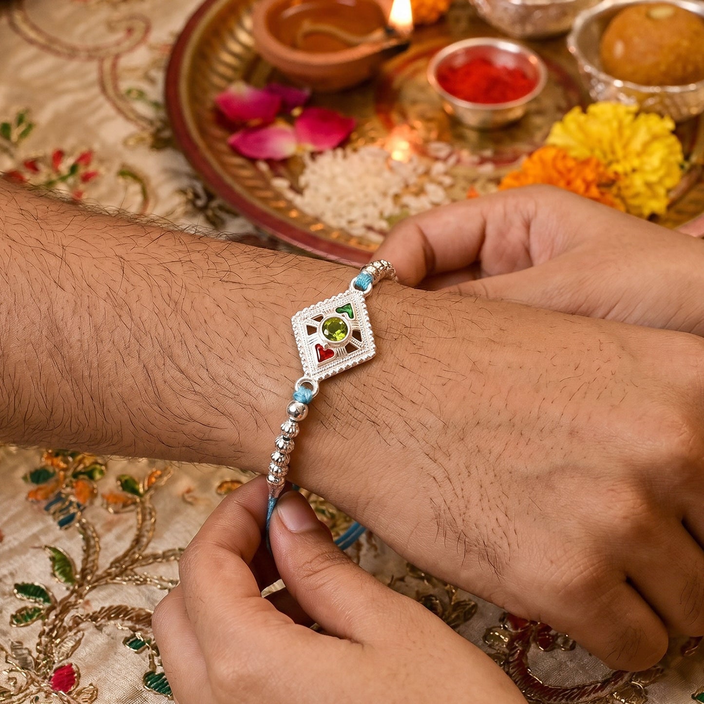 Silver Diamond Kundan Rakhi with Green Stone and Blue Beads