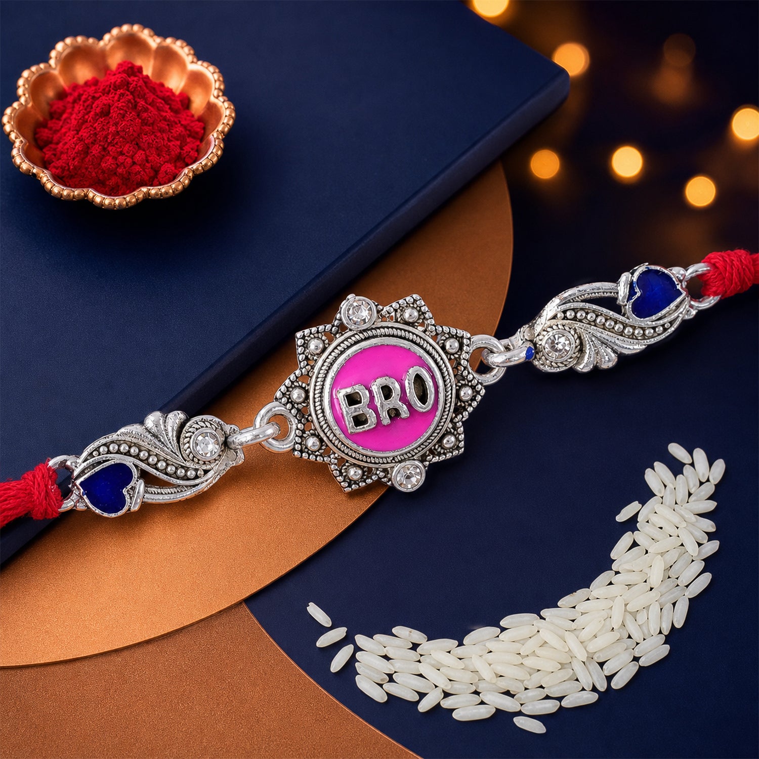 Silver-Toned BRO Rakhi with Pink Enamel, Blue Heart Accents, Crystals & Red Thread