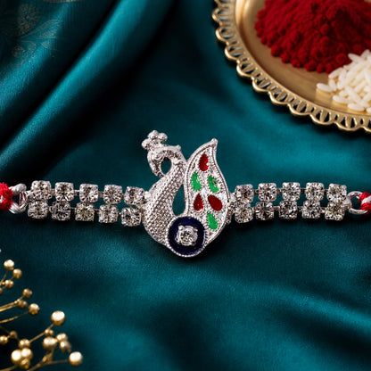 Silver-Toned Peacock Rakhi with Multicolor Enamel, Double Crystal Chain & Red Thread