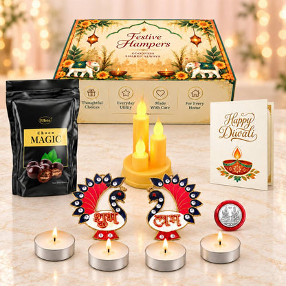 A Diwali gift set with chocolate, LED candles, tealights, peacock decor, a silver coin, and a greeting card.