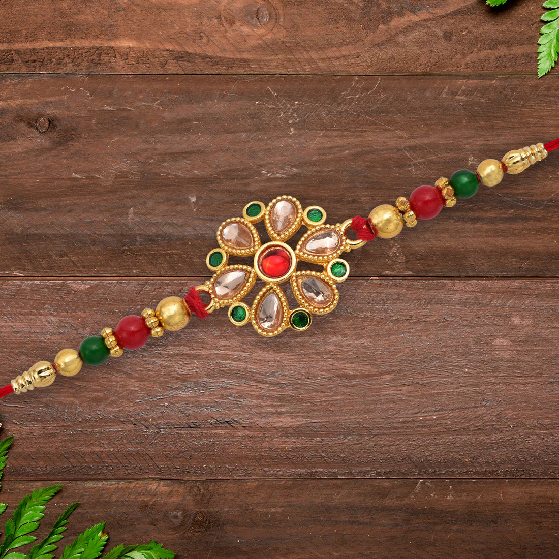 Kundan Rakhi – Elegant Floral Golden Design for Raksha Bandhan