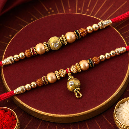 Golden Orb Couple Rakhi Set with Amber Beads and Hanging Charm for Bhaiya Bhabhi