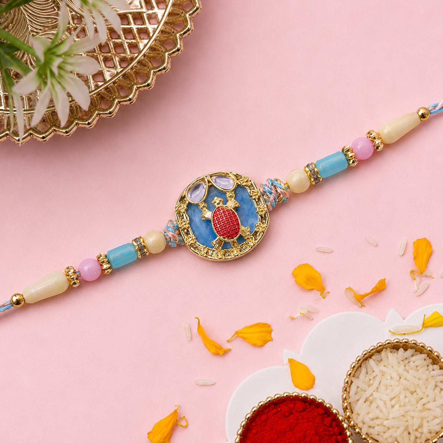 Elegant Blue Designer Rakhi for Brother with Golden Pendant & Premium Bead Work