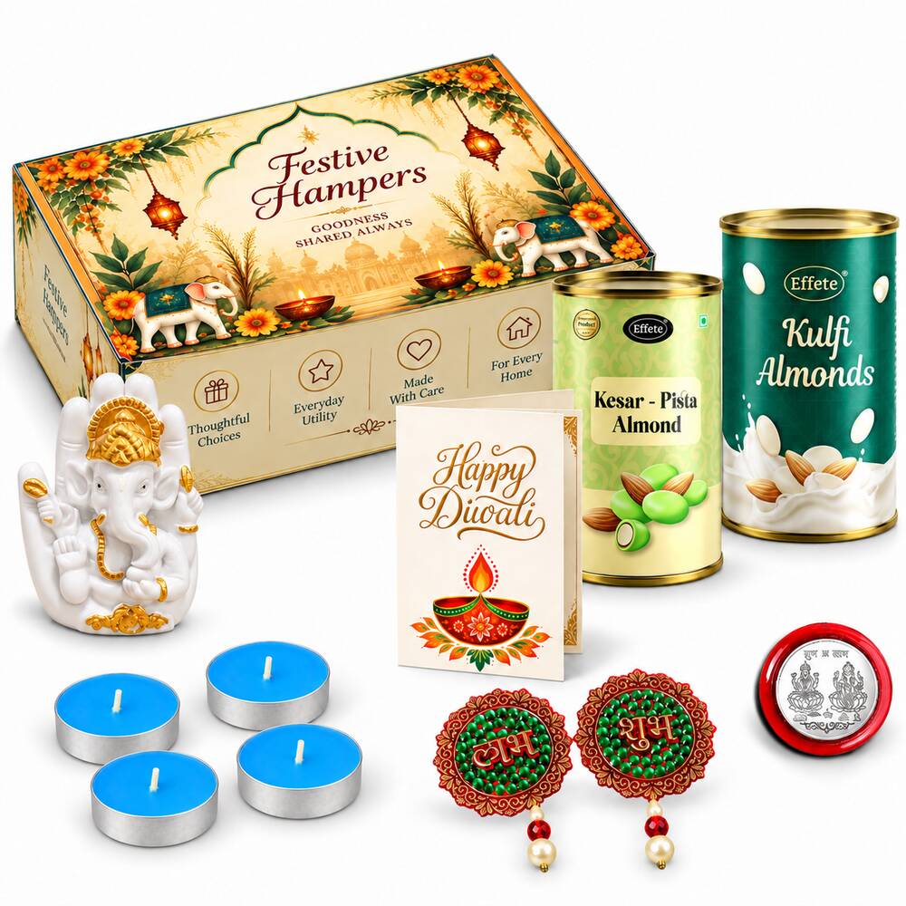 A white Ganesha idol, four blue tealights, two almond tins, a Diwali card, and decorative earrings are arranged with a gift