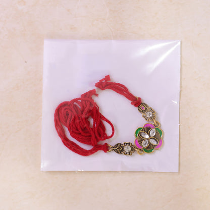 Ornate Rakhi with Floral Medallion, multicolor stones and chain look for Gifting